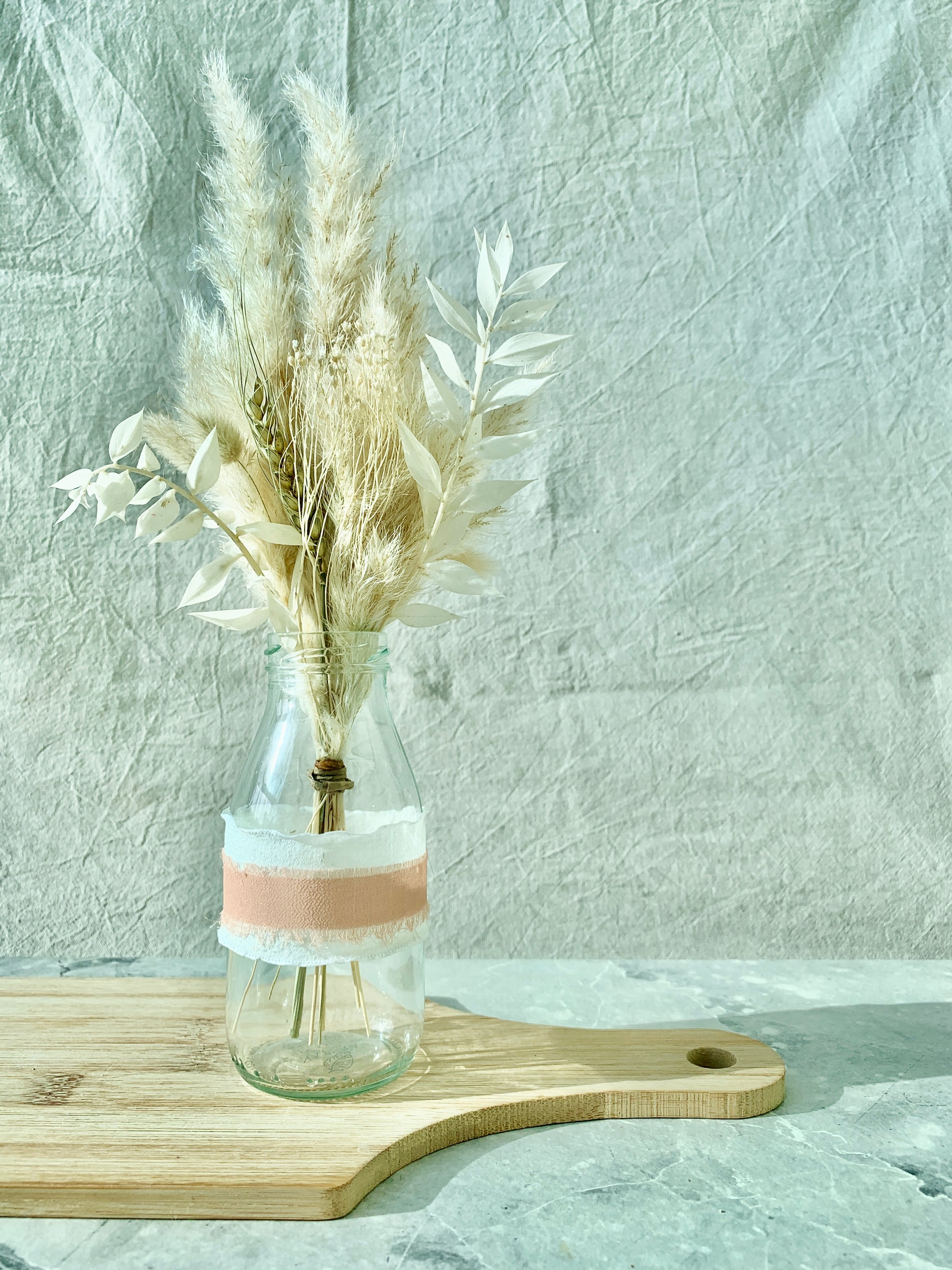 White and blush milk bottle vase