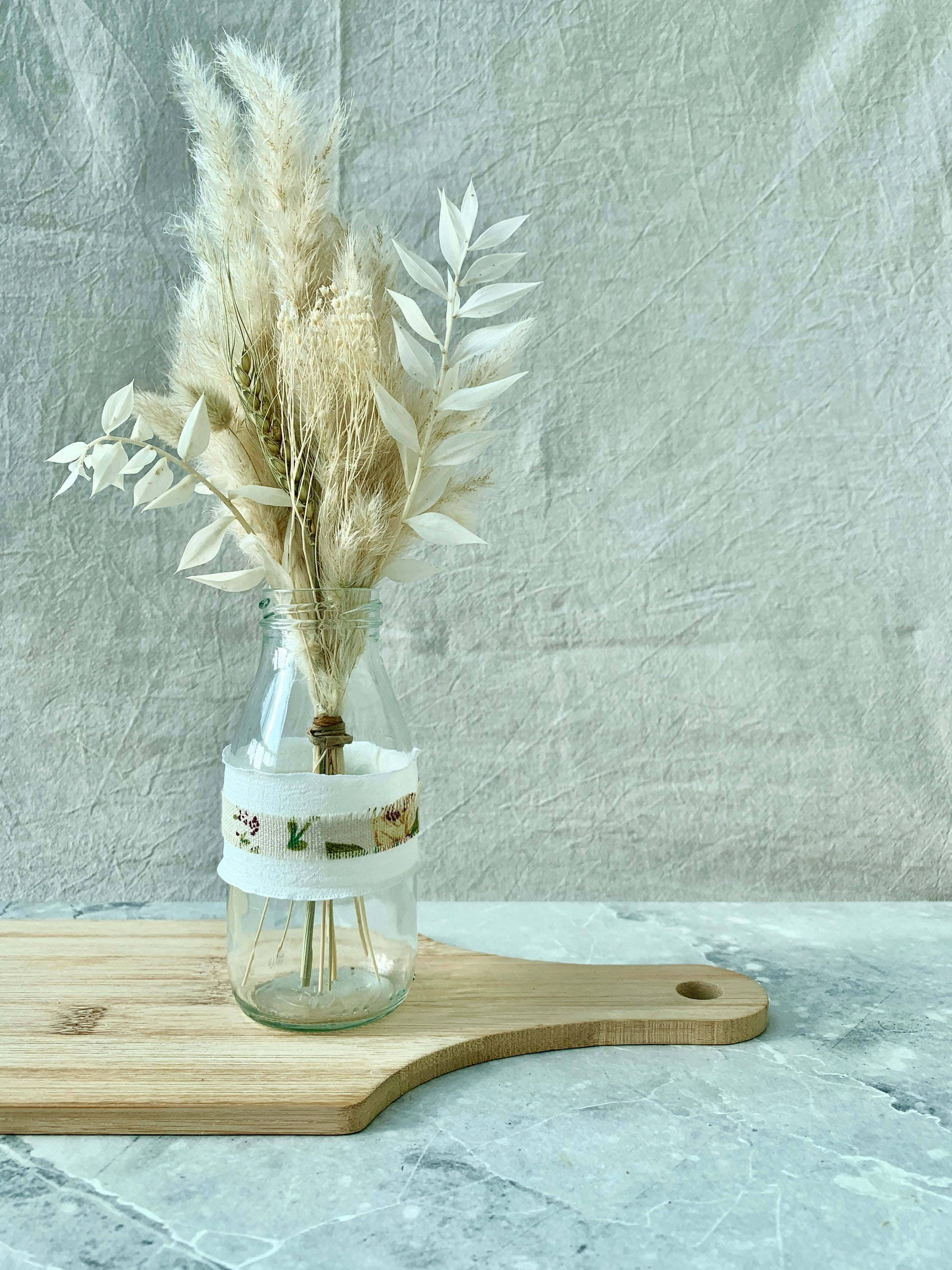 White and flower milk bottle vase